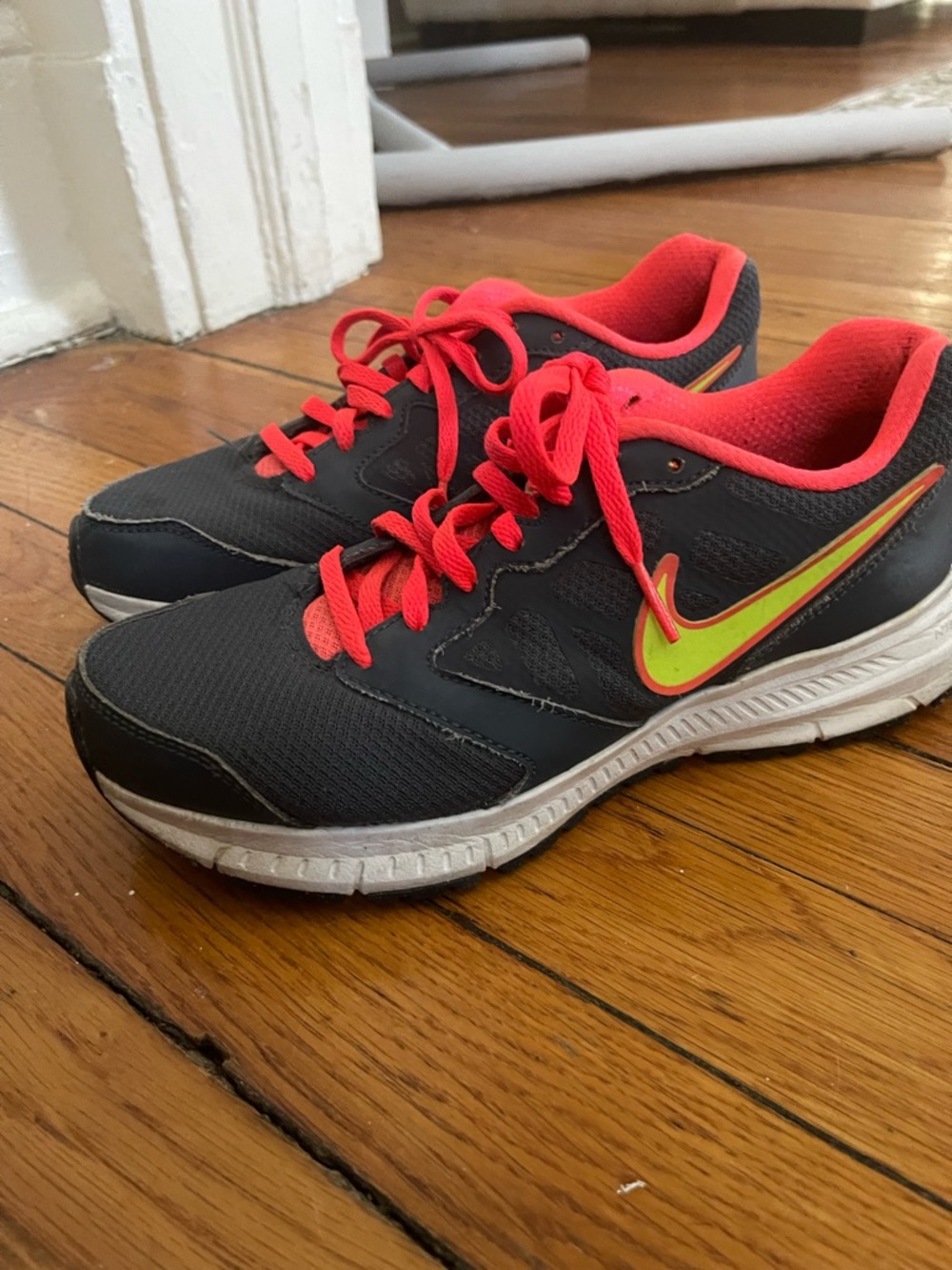 Nike Black Running Shoes with Neon Yellow Swoosh and Coral Accents